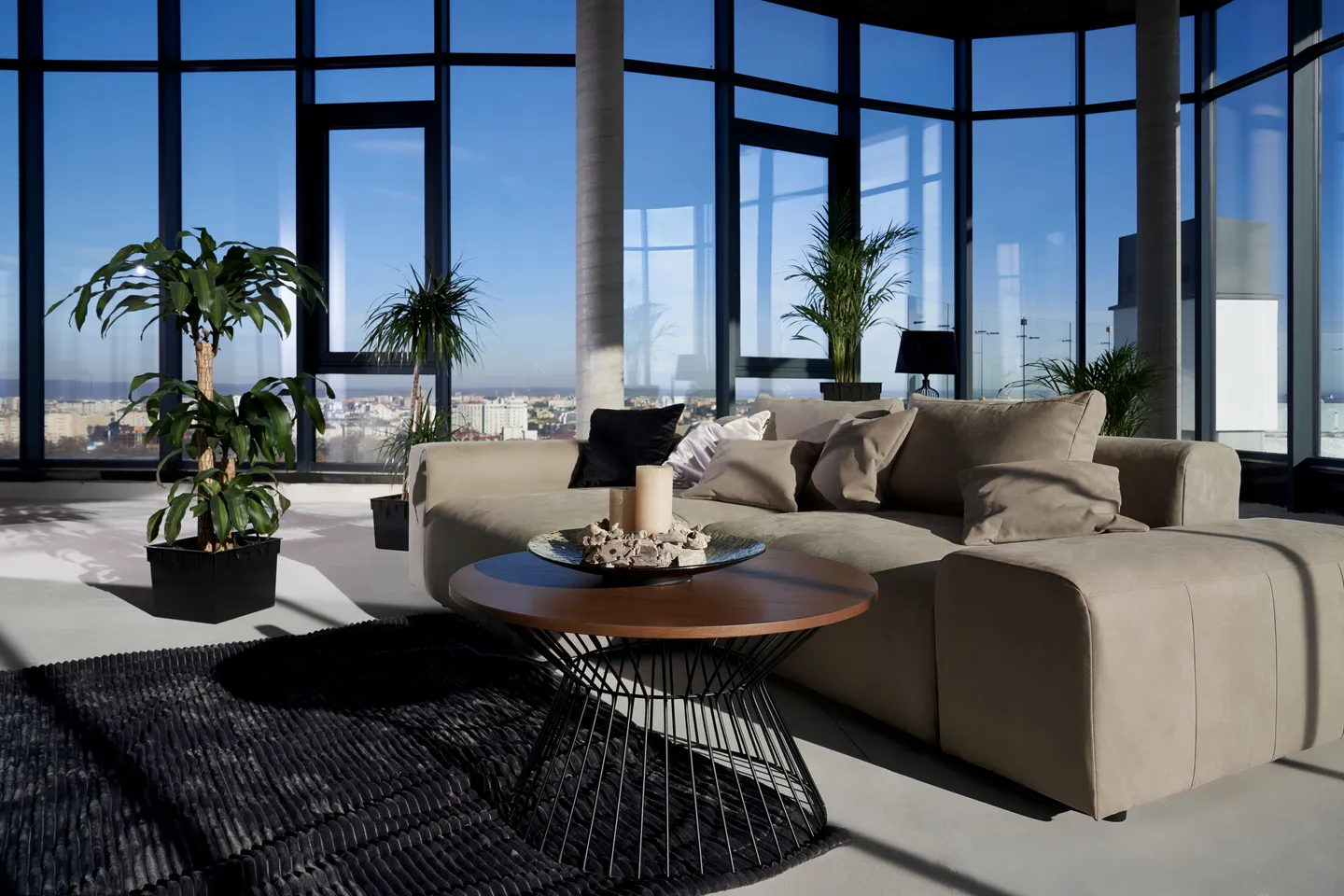 Penthouse view of city skyline with river and bridge
